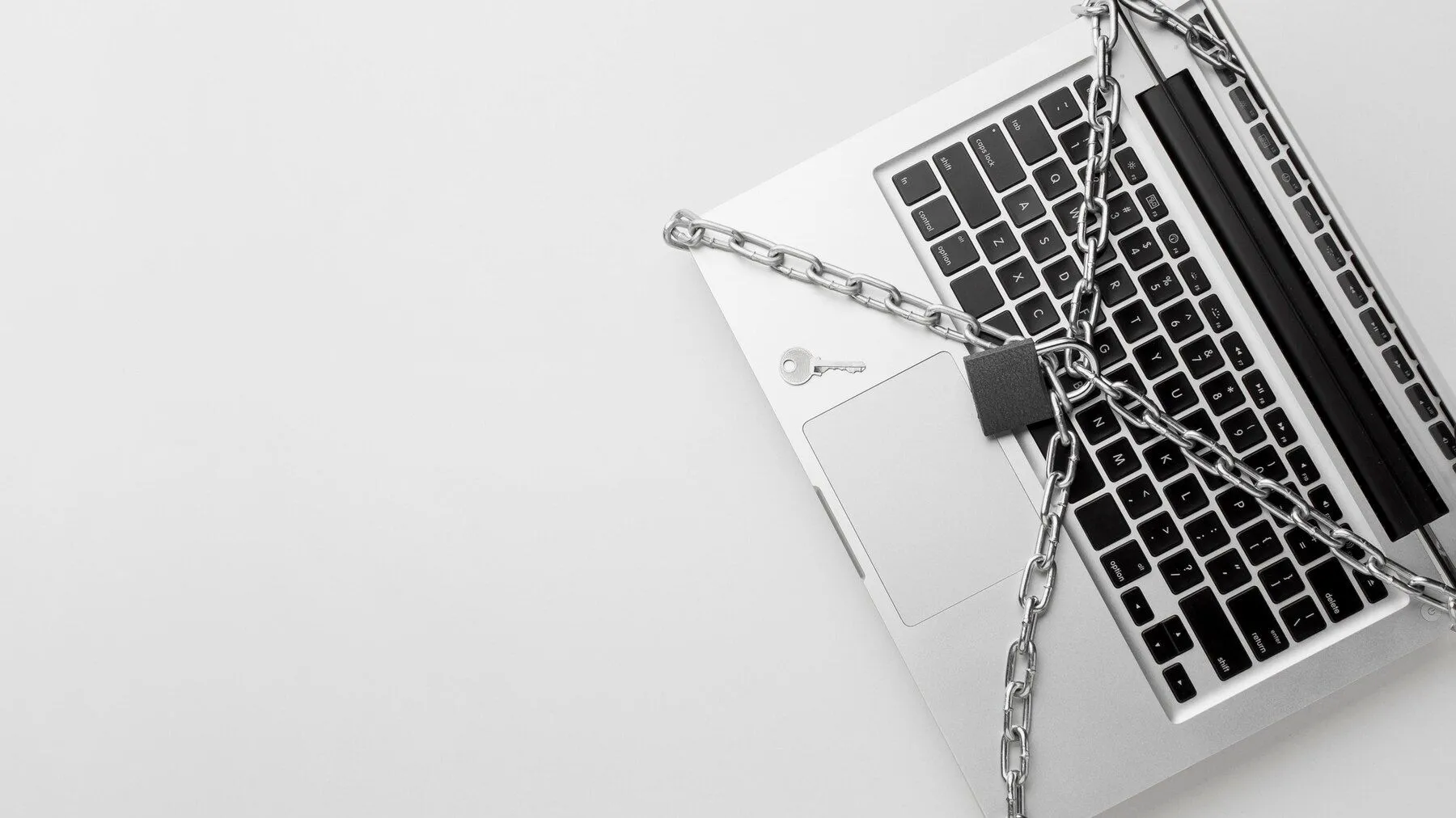 top view laptop protected by metal chain lock with copy space 23 2148578053